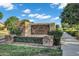 Welcoming community entrance sign featuring stone accents and lush landscaping at Legacy at Seville by Toll Brothers at 3842 E Alameda Ln, Gilbert, AZ 85298