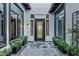 Charming entrance area featuring black windows and black potted plants at 3842 E Alameda Ln, Gilbert, AZ 85298
