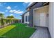 Lawn and entrance featuring green grass and patterned brick entryway at 3842 E Alameda Ln, Gilbert, AZ 85298