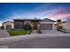Stunning home exterior at dusk with professional landscaping and a welcoming entrance at 3842 E Alameda Ln, Gilbert, AZ 85298