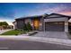 Elegant home showcasing contemporary architecture, a well-manicured lawn, and great curb appeal at 3842 E Alameda Ln, Gilbert, AZ 85298