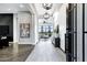 Inviting foyer with light wood flooring, shiplap wall, and stylish light fixtures at 3842 E Alameda Ln, Gilbert, AZ 85298