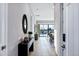 Inviting hallway featuring herringbone floors and stylish console table decor, leading to a bright living space at 3842 E Alameda Ln, Gilbert, AZ 85298