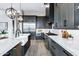 Bright kitchen features sleek stainless steel appliances, grey cabinets, and stylish countertops at 3842 E Alameda Ln, Gilbert, AZ 85298
