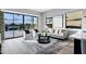 Elegant living room showcasing plush seating, area rug, and a scenic view through large sliding glass doors at 3842 E Alameda Ln, Gilbert, AZ 85298
