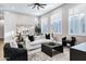 Bright living room with modern furniture, large windows and decorative accents at 3842 E Alameda Ln, Gilbert, AZ 85298