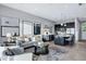 Open-concept living space seamlessly combining a modern kitchen with a comfortable seating area and outdoor views at 3842 E Alameda Ln, Gilbert, AZ 85298