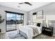 Serene main bedroom featuring sliding glass doors to the backyard, neutral decor, and stylish bedside tables at 3842 E Alameda Ln, Gilbert, AZ 85298