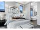 Primary bedroom featuring a comfortable bed, stylish decor, and an en-suite bathroom at 3842 E Alameda Ln, Gilbert, AZ 85298