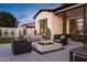 Relaxing outdoor patio with stylish seating around a modern fire pit, perfect for entertaining under the evening sky at 3842 E Alameda Ln, Gilbert, AZ 85298