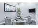 Welcoming sitting room with plush chairs, a round coffee table, and a large mirror for added depth at 3842 E Alameda Ln, Gilbert, AZ 85298
