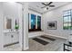 Bright workout space with a view into the bathroom, large windows, built-in bench, and ceiling fan at 3842 E Alameda Ln, Gilbert, AZ 85298