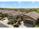 Birds eye view of multiple houses featuring a two car garage and tile roofing at 40055 N High Noon Way, Anthem, AZ 85086
