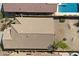 Aerial shot focusing on roof, desert landscaped backyard, and covered patio at 40055 N High Noon Way, Anthem, AZ 85086