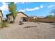 A desert landscaped backyard with gravel and a low-maintenance block wall fence at 40055 N High Noon Way, Anthem, AZ 85086