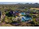 Aerial view showcasing a community center with pools, playgrounds, and recreational areas at 40055 N High Noon Way, Anthem, AZ 85086
