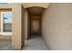 Inviting front entryway with a tan door and tiled flooring at 40055 N High Noon Way, Anthem, AZ 85086