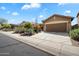 Beautiful single-story home featuring a 2-car garage and desert landscaping at 40055 N High Noon Way, Anthem, AZ 85086