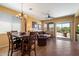 Inviting dining and living area with tile floors, comfortable seating, and natural light at 40055 N High Noon Way, Anthem, AZ 85086