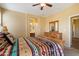 Main bedroom featuring a full view of bathroom, walk in closet, and comfortable bed at 40055 N High Noon Way, Anthem, AZ 85086