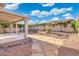 Enjoy this home's outdoor living with covered patio, meticulous desert landscaping and mature privacy hedges at 4446 E Woodridge Dr, Phoenix, AZ 85032
