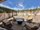 Picturesque backyard showcasing a fire pit area with comfortable seating, surrounded by lush landscaping and serene ambiance at 4446 E Woodridge Dr, Phoenix, AZ 85032