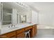 Bathroom features dual sinks, large mirror, separate shower and bath at 4446 E Woodridge Dr, Phoenix, AZ 85032