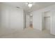 Bedroom with carpet flooring, closet, ceiling fan, and two doors at 4446 E Woodridge Dr, Phoenix, AZ 85032