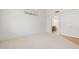 Bedroom with neutral carpet and adjacent bath showcasing natural light at 4446 E Woodridge Dr, Phoenix, AZ 85032