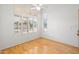 Bright bedroom with hardwood floors and large windows with plantation shutters at 4446 E Woodridge Dr, Phoenix, AZ 85032