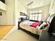 A bedroom with neutral walls, carpeted flooring, and natural lighting at 4446 E Woodridge Dr, Phoenix, AZ 85032