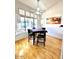 Cozy breakfast nook with many windows, hardwood floors and a hanging light at 4446 E Woodridge Dr, Phoenix, AZ 85032