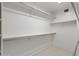 Walk-in closet features extensive shelving and ample storage space at 4446 E Woodridge Dr, Phoenix, AZ 85032