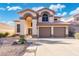 Inviting two-story home featuring a terracotta roof and a spacious two-car garage at 4446 E Woodridge Dr, Phoenix, AZ 85032