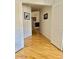 Bright hallway with hardwood floors leads to living area at 4446 E Woodridge Dr, Phoenix, AZ 85032