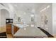 Open kitchen with granite counters, large sink, and vaulted ceiling with fan at 4446 E Woodridge Dr, Phoenix, AZ 85032
