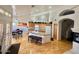 Bright open kitchen with an island, an eat in area and lots of storage at 4446 E Woodridge Dr, Phoenix, AZ 85032
