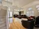 Bright living room featuring hardwood floors, cozy seating, and lots of natural light at 4446 E Woodridge Dr, Phoenix, AZ 85032