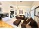 Inviting living room with a brick fireplace, plush seating, and bright natural light at 4446 E Woodridge Dr, Phoenix, AZ 85032