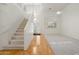 Open concept living area with high ceilings, staircase, and natural light at 4446 E Woodridge Dr, Phoenix, AZ 85032