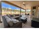 Covered patio area with comfortable seating and an open view of the backyard at 4446 E Woodridge Dr, Phoenix, AZ 85032