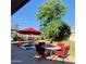 Inviting backyard with a sparkling pool, patio furniture, lush lawn, and shade trees, perfect for outdoor living at 4611 E Monterosa St, Phoenix, AZ 85018
