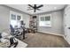 Bedroom with carpet floor, ceiling fan, natural light and a work space perfect for focusing on projects at 4611 E Monterosa St, Phoenix, AZ 85018