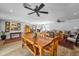 Open-concept dining room flowing into a living area features hardwood floors and a stylish ceiling fan at 4611 E Monterosa St, Phoenix, AZ 85018