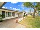 Charming covered entryway with brick accents and well-maintained landscaping at 4611 E Monterosa St, Phoenix, AZ 85018