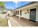 Covered entryway featuring brick accents and elegant outdoor lighting at 4611 E Monterosa St, Phoenix, AZ 85018