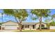 Charming single-story home with a well-manicured lawn and mature trees at 4611 E Monterosa St, Phoenix, AZ 85018