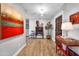 Charming hallway featuring hardwood floors, decorative art, and a traditional wooden table with lamp at 4611 E Monterosa St, Phoenix, AZ 85018