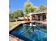 Sparkling pool with beautiful backyard view, patio and seating perfect for entertaining at 4611 E Monterosa St, Phoenix, AZ 85018