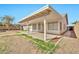 A covered back patio with ample space and a well-kept yard, perfect for relaxing or entertaining at 5029 N 86Th Dr, Glendale, AZ 85305